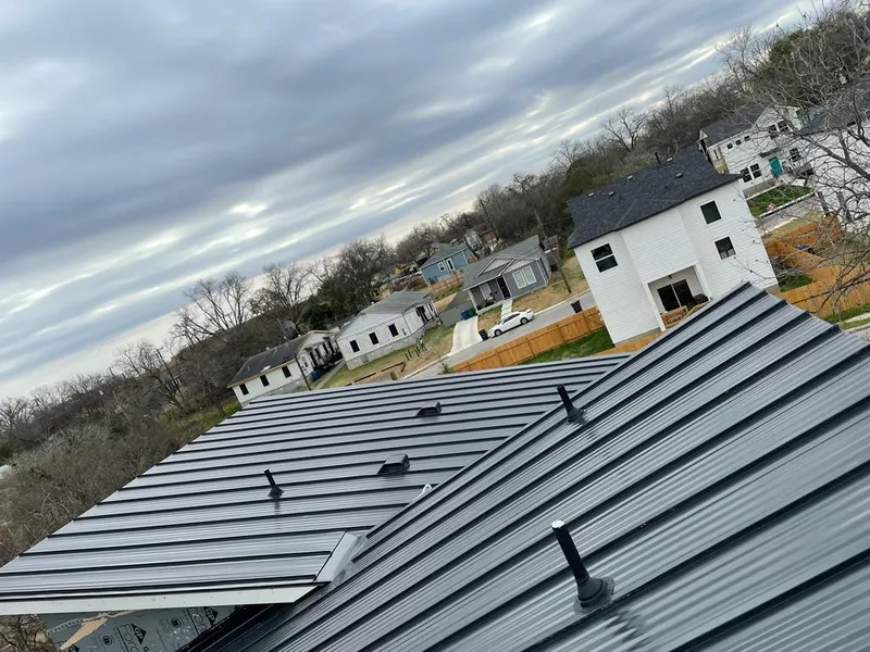 Standing seam metal roof panels with vents for Skylight Repair in Webster